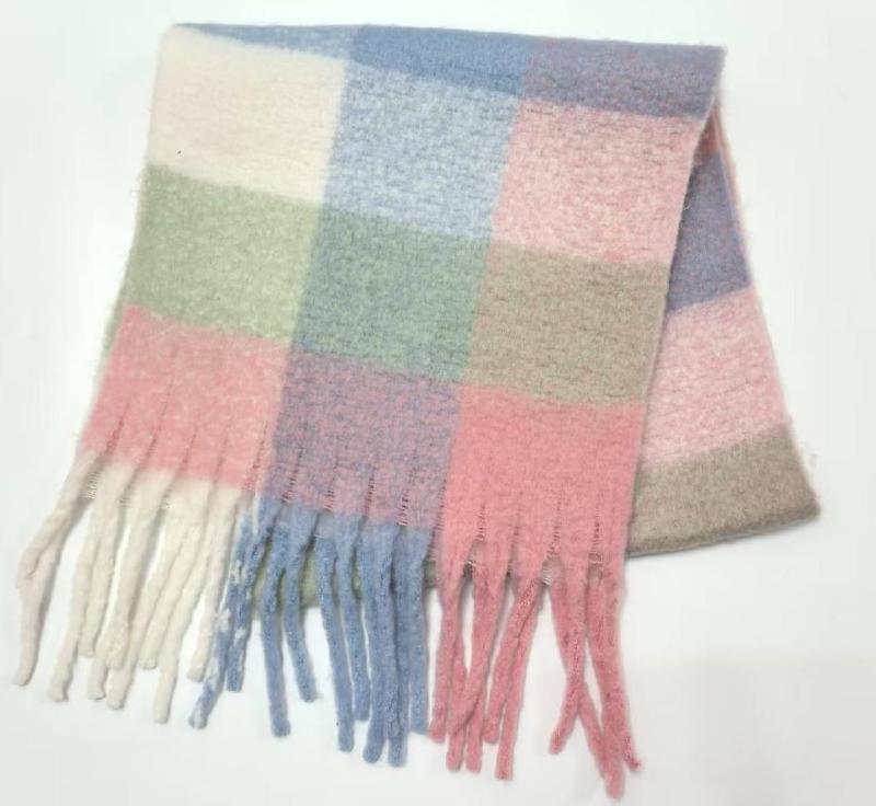 Soft pastel plaid scarf with large pink, blue, green, and cream checks and knotted fringe tassels on white background